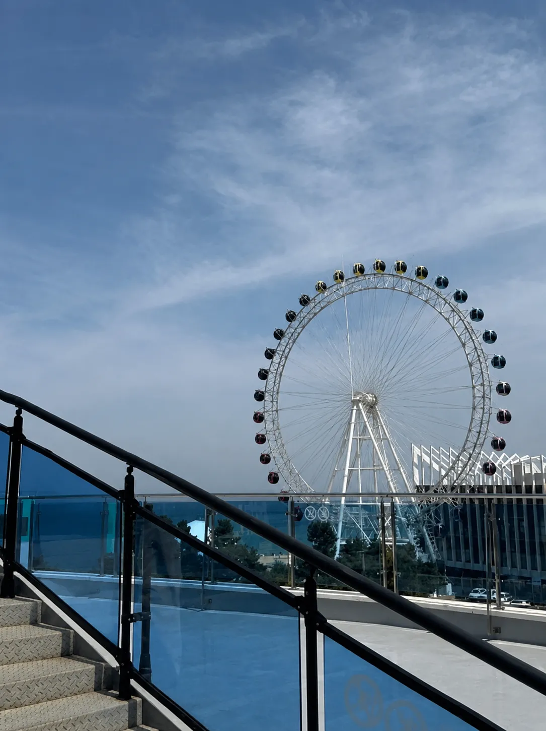 The Sokcho Eye beyond the glass railing of the Sky Stairs viewpoint